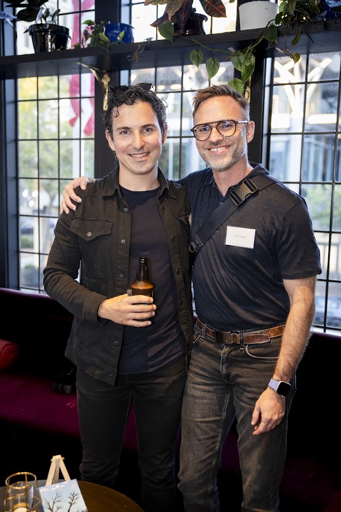 Marco networking with a business partner at an event